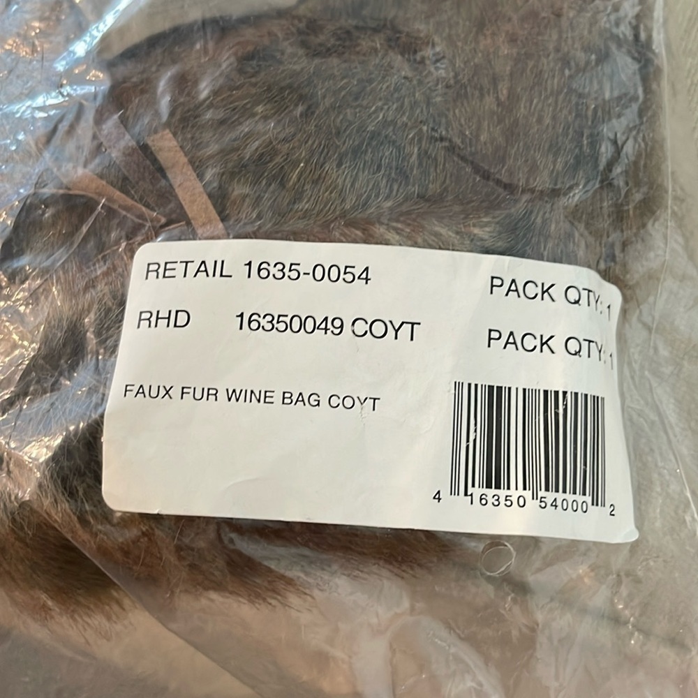 Pottery Barn faux fur wine bag in Coyote. Brand new and unused.